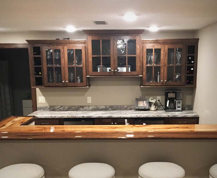 remodeling an unfinished basement - custom bar and living area